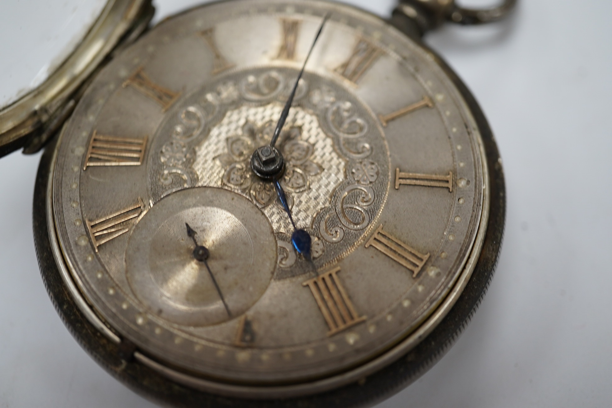 A late Victorian silver open faced keywind pocket watch, with Roman dial and subsidiary seconds. Condition - poor